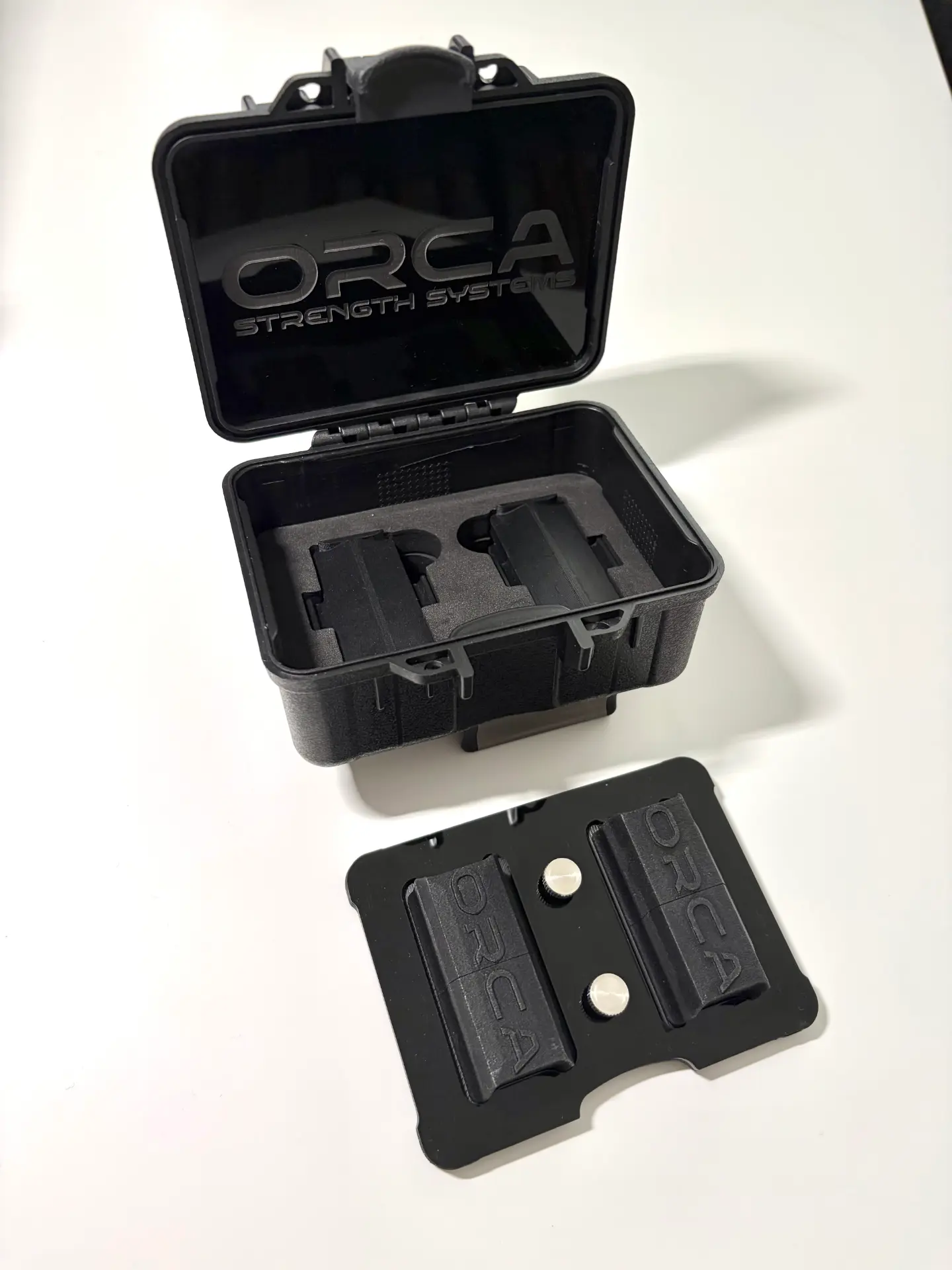 Custom foam cut for two sensors and adapters.